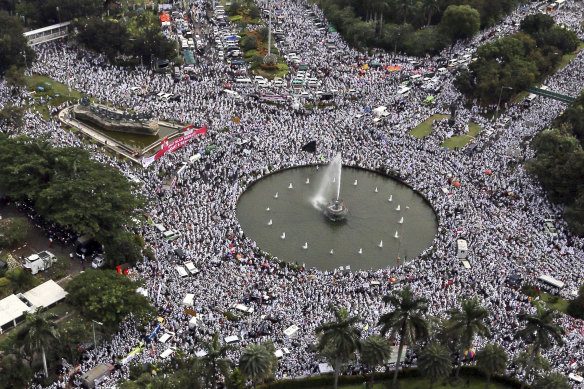 Indonesians Muslims fill the streets of Jakarta rallying against the then governor of Jakarta, Basuki Tjahaja Purnama, whom they accused of blasphemy.