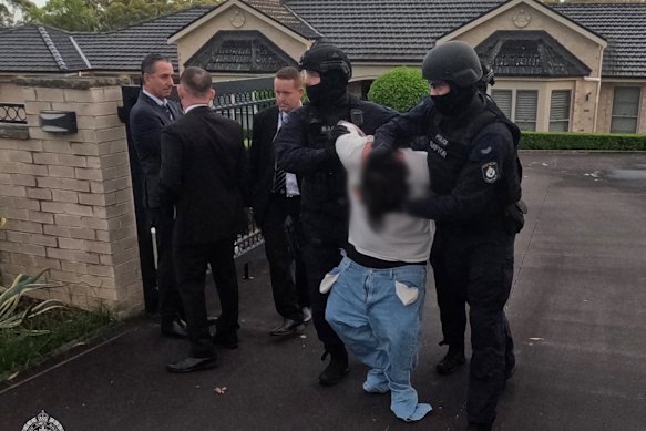 Gerard Andrews is picked up from his family's home in Kenthurst.