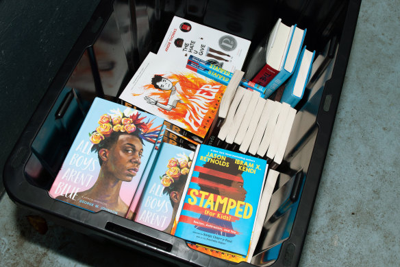 Books that are among a ban list at a rally in Tallahassee, Florida, on March 21, 2023.