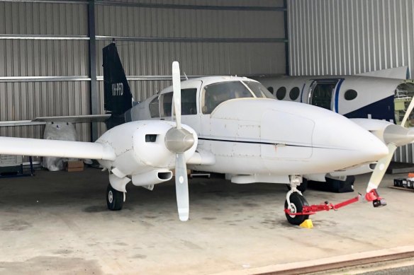 The Aztec at a hangar at Jandakot Airpot. 