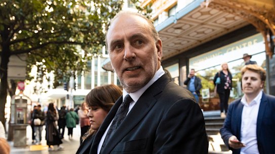 Brian Houston leaves Downing Centre Local Court on Friday.