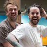 Owners Josh Uljans (left) and Karl van Buuren ride the mechanical bull at Moon Dog Brewery in Footscray.