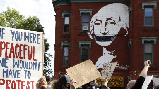 Demonstrators march to protest the death of George Floyd in Washington. 