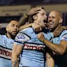 SYDNEY, AUSTRALIA - JULY 11: Nicho Hynes of the Sharks celebrates a try during the round 19 NRL match between Cronulla Sharks and Dolphins at Sharks Stadium, on July 11, 2025, in Sydney, Australia. (Photo by Darrian Traynor/Getty Images)