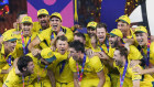 Australia’s players celebrate with the trophy after Australia won the ICC Men’s Cricket World Cup final in Ahmedabad.