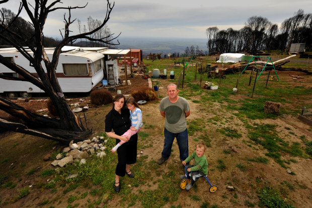 Shane and Bron Sparkes, with Lola and Dom, lived in a caravan on their property after the Black Saturday fires.