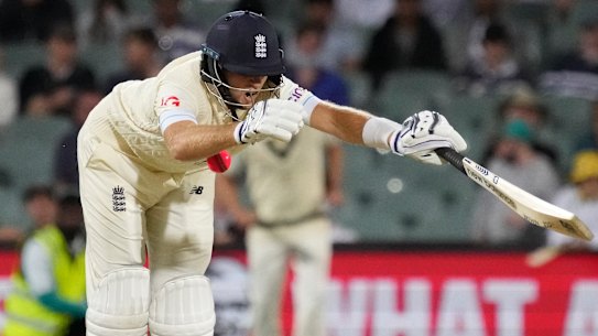 Joe Root is hit by a ball from Mitchell Starc.