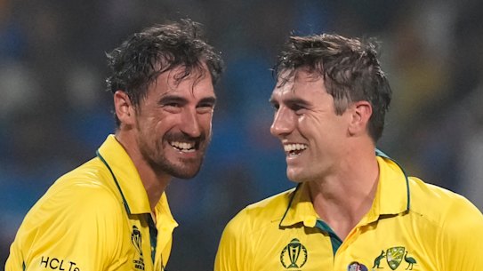 Cashing in: Mitchell Starc and Pat Cummins.