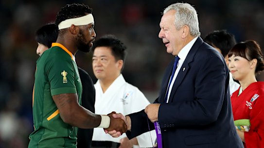 Bill Beaumont, right, has won a second term as World Rugby chairman. 