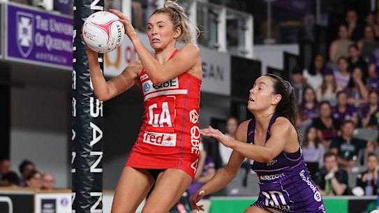 BRISBANE, AUSTRALIA - APRIL 30: Helen Housby of the Swifts catches the ball during the round seven Super Netball match between Queensland Firebirds and NSW Swifts at Nissan Arena, on April 30, 2022, in Brisbane, Australia. (Photo by Jono Searle/Getty Images)