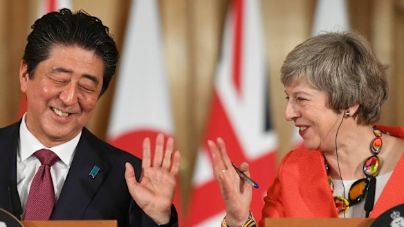 Theresa May and Shinzo Abe  hold a press conference in 10 Downing Street.