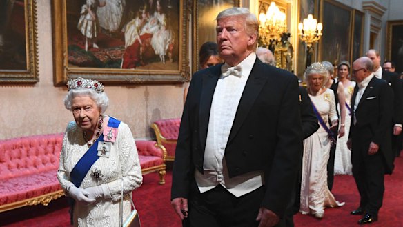 The Queen and US President Donald Trump arrive at a state banquet at Buckingham Palace in London during his state visit.