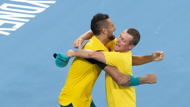Kyrgios and Hewitt embrace after victory over Team GB in the ATP Cup in Sydney.
