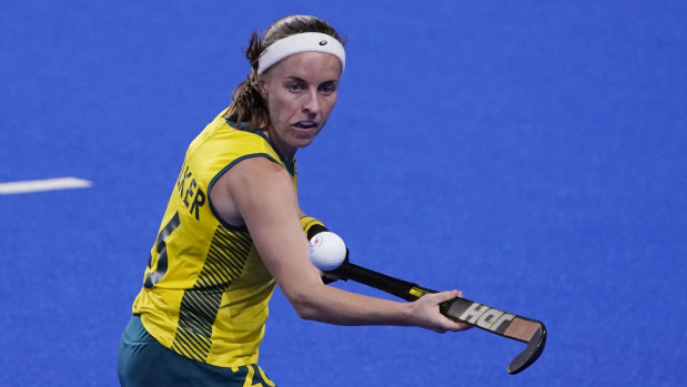 Australia’s Emily Chalker knocks the ball out of the air.