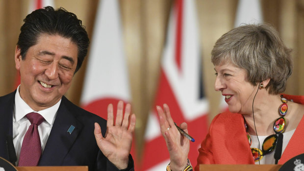 Theresa May and Shinzo Abe  hold a press conference in 10 Downing Street.