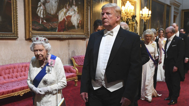 The Queen and US President Donald Trump arrive at a state banquet at Buckingham Palace in London during his state visit.