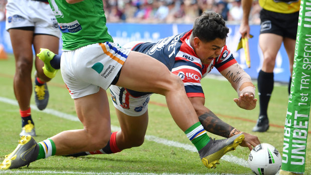 Latrell Mitchell scores his first of two first-half tries against the Raiders. 