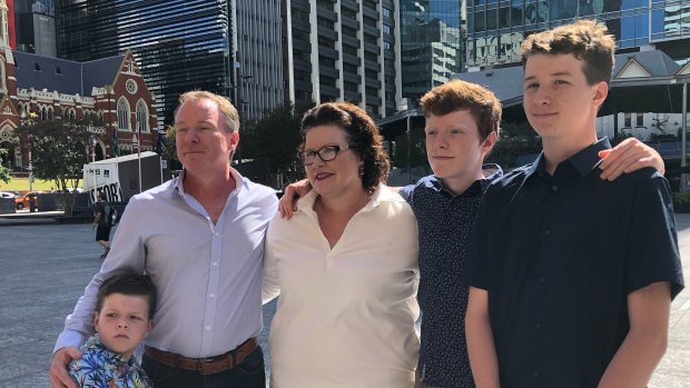 Kate Richards and family outside Brisbane City Hall as she makes a statement.