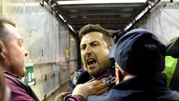 Security and police swooped on a Manly fan, centre, who confronted Melbourne Storm’s Will Chambers on Saturday night at Lottoland.