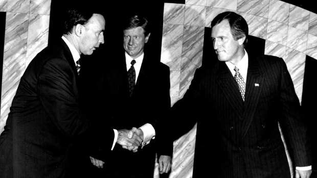Paul Keating and John Hewson shake hands before their 1993 debate on national television. 