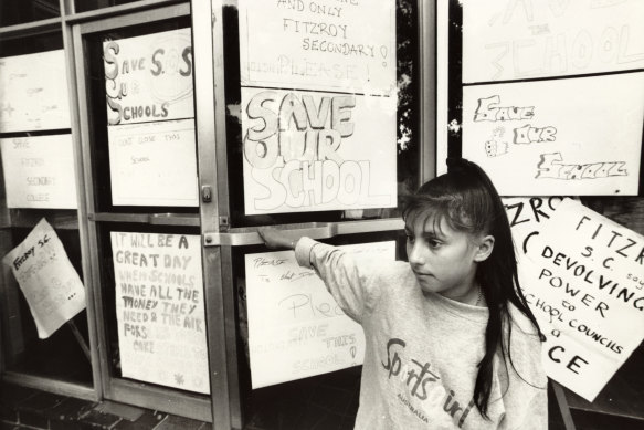 Sara Ergul, a Year 7 student at Fitzroy Secondary College at the school's entrance surrounded by students' protests posters.