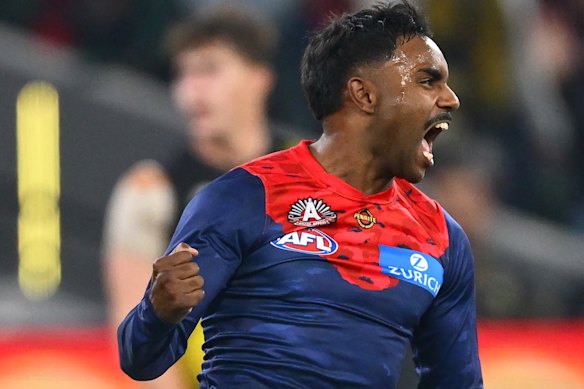 Kysaiah Pickett of the Demons celebrates kicking a goal.