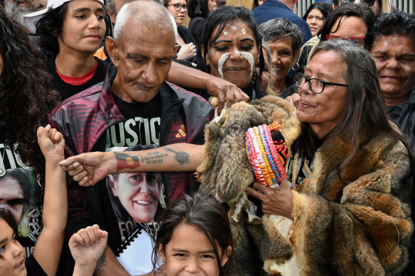 Friends, family and supporters of Veronica Nelson, an Indigenous woman who died in custody in Victoria, outside the Coroner’s court on Monday. In the centre of the frame, flanked by supporters, are Nelson’s partner, Percy Lovett, and mother, Aunty Donna Nelson.