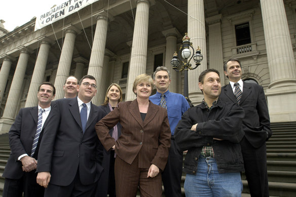 A 2003 photo of Labor MPs on the  steps of Parliament. [L-R] Rob Hudson, Richard Wynne, Daniel Andrews, Jacinta Allan, Maxine Morand, John Lenders, Alistair Harkness and Bruce Mildenhall. 