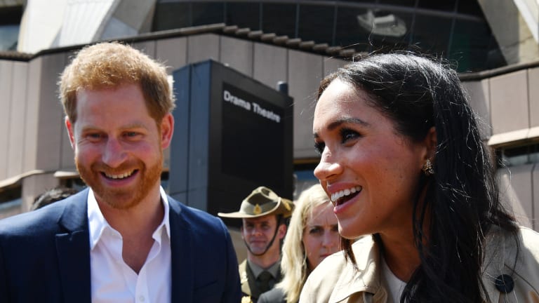 Prince Harry and his wife Meghan meet the people of Sydney at the Opera House on Tuesday. 