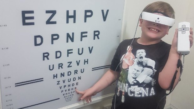Max testing eSight glasses at the Royal Society for the Blind in Adelaide.