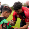 Latrell Mitchell takes time out with a young Perth-based fan.