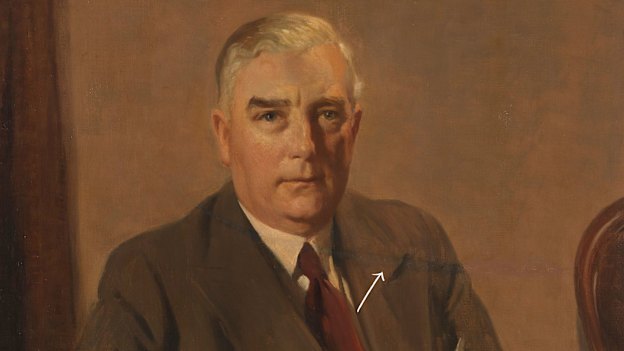 The ghost of the slash can still be seen here, running from Menzies’ right shoulder across to the chair.