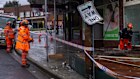 Emergency services personnel in Croydon, Sydney, where wind brought down an awning.