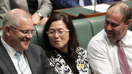 Liberal MP Gladys Liu flanked by Prime Minister Scott Morrison and Treasurer Josh Frydenberg in Parliament last week.