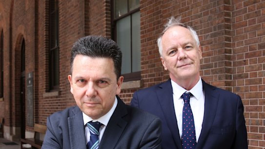 Former independent Senator Nick Xenophon and his law partner, former ABC foreign correspondent Mark Davis, outside the Supreme Court in Sydney.