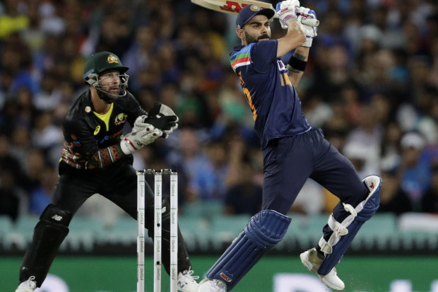 Earl Eddings says one day we will wonder how we managed to get India to Australia for a full series. Pictured is Indian captain Virat Kohli and Australian counterpart Matt Wade in the T20 this week at the SCG.