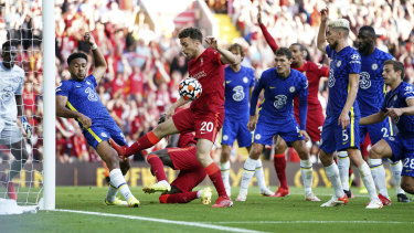Chelsea’s Reece James, second left, hand-balls on the goal line, resulting in a red card and a penalty given to Liverpool during their EPL match at Anfield.