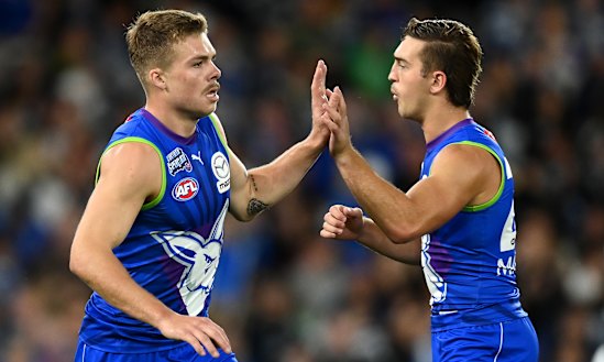 Top-three pick Will Phillips (right) is stuck in North Melbourne’s reserves.