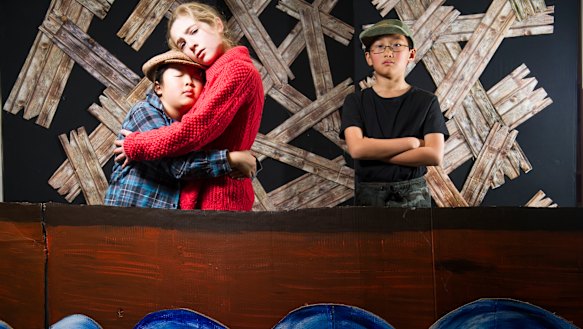 Torrens Primary year five students Catherine Bashford, Samantha Khaw and Christian Wang, part of a story dance about asylum seekers.