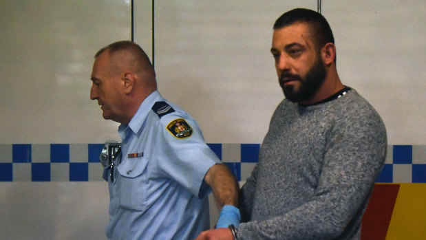 Ricardo Barbaro escorted to a prison van at Burwood Court in Sydney on Thursday. 