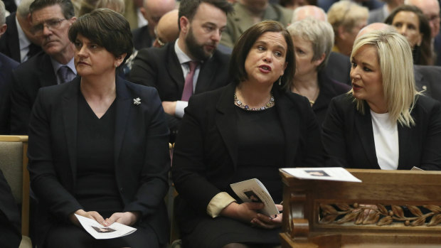 Democratic Unionist leader Arlene Foster (left) and Sinn Fein leader Mary Lou McDonald (centre) sit together at Lyra McKee's funeral, but cannot form a power-sharing government.
