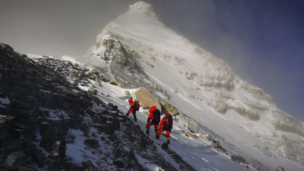 Members of a Chinese surveying team head for the summit of Mount Everest in May.