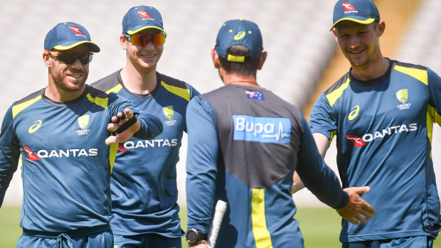 David Warner, Steve Smith and Cameron Bancroft greeted by Justin Langer at training on Monday.