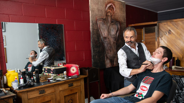 The TRACE art program puts work from some of Australia's top artists into West End businesses, including a barbershop.