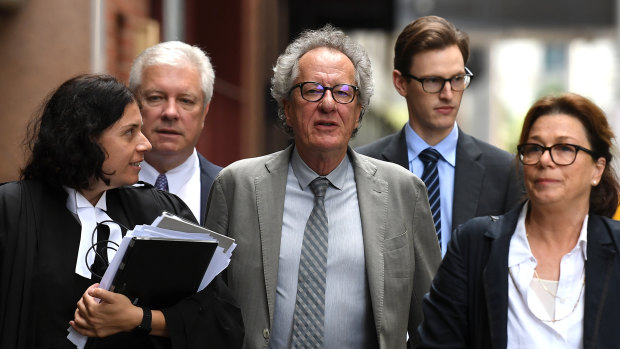 Geoffrey Rush, flanked by his barrister Sue Chrysanthou and wife Jane Menelaus, arrives at the Federal Court on Friday.