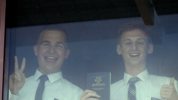 Young Mormons seen through their hotel room window while in quarantine at the Novotel in Brisbane.