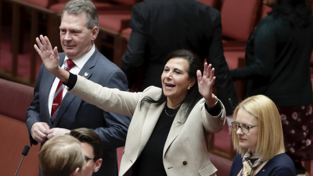 Senator Concetta Fierravanti-Wells takes her seat on the backbench during debate in the Senate at Parliament House in Canberra.