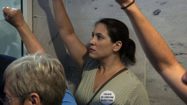 Demonstrators stand outside the office of Senator Chuck Grassley, the Republican chairman of the Senate Judiciary Committee, during a protest against Supreme Court nominee Brett Kavanaugh on Capitol Hill.