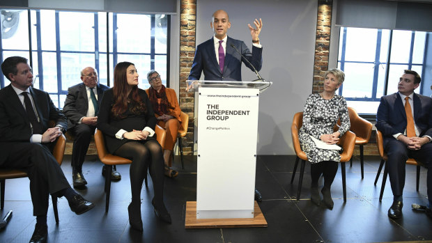 Labour MP Chuka Umunna (centre) speaks to the media during a press conference with a group of six other Labour MPs.