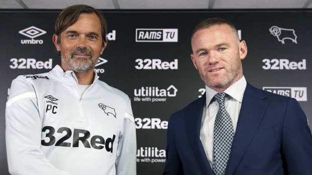 Master and the apprentice: Rooney with Derby County manager Phillip Cocu.